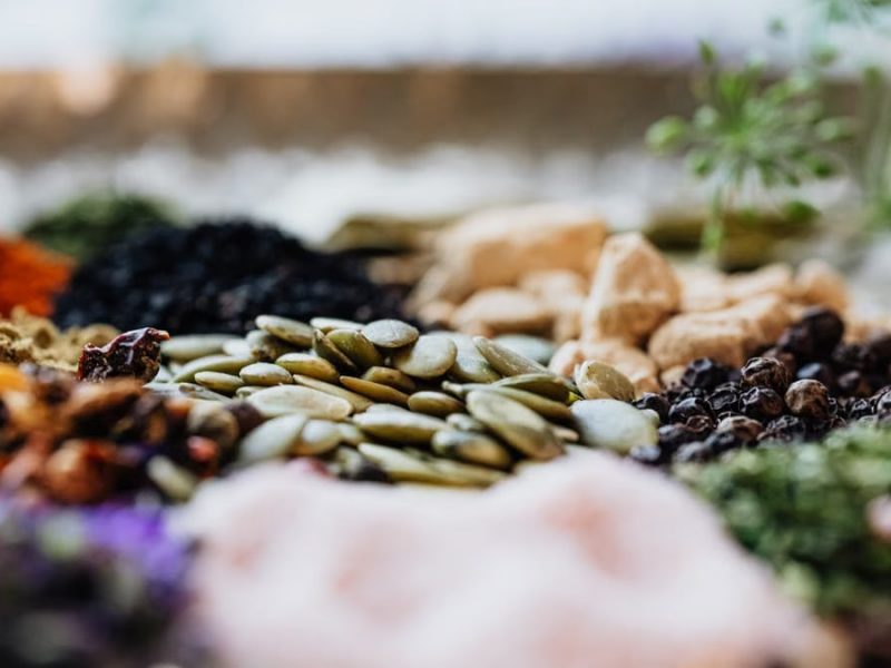 Close-up of assorted spices and seeds showcasing culinary diversity.